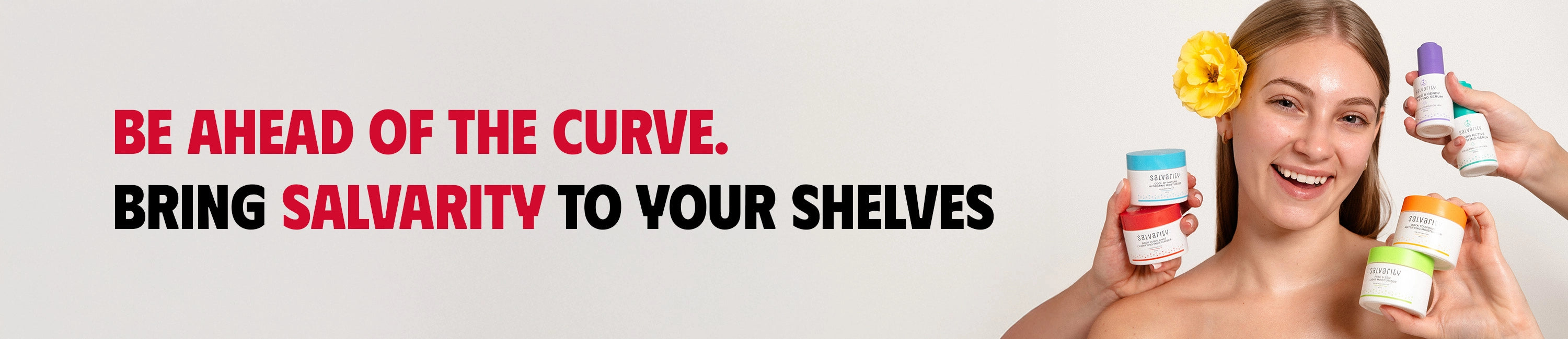 website banner for salvarity including a girl with skincare products